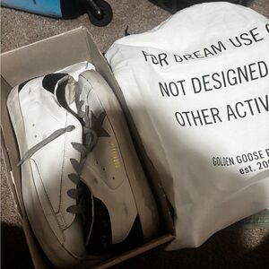 Golden Goose White Sneakers with Black and Gold Accents